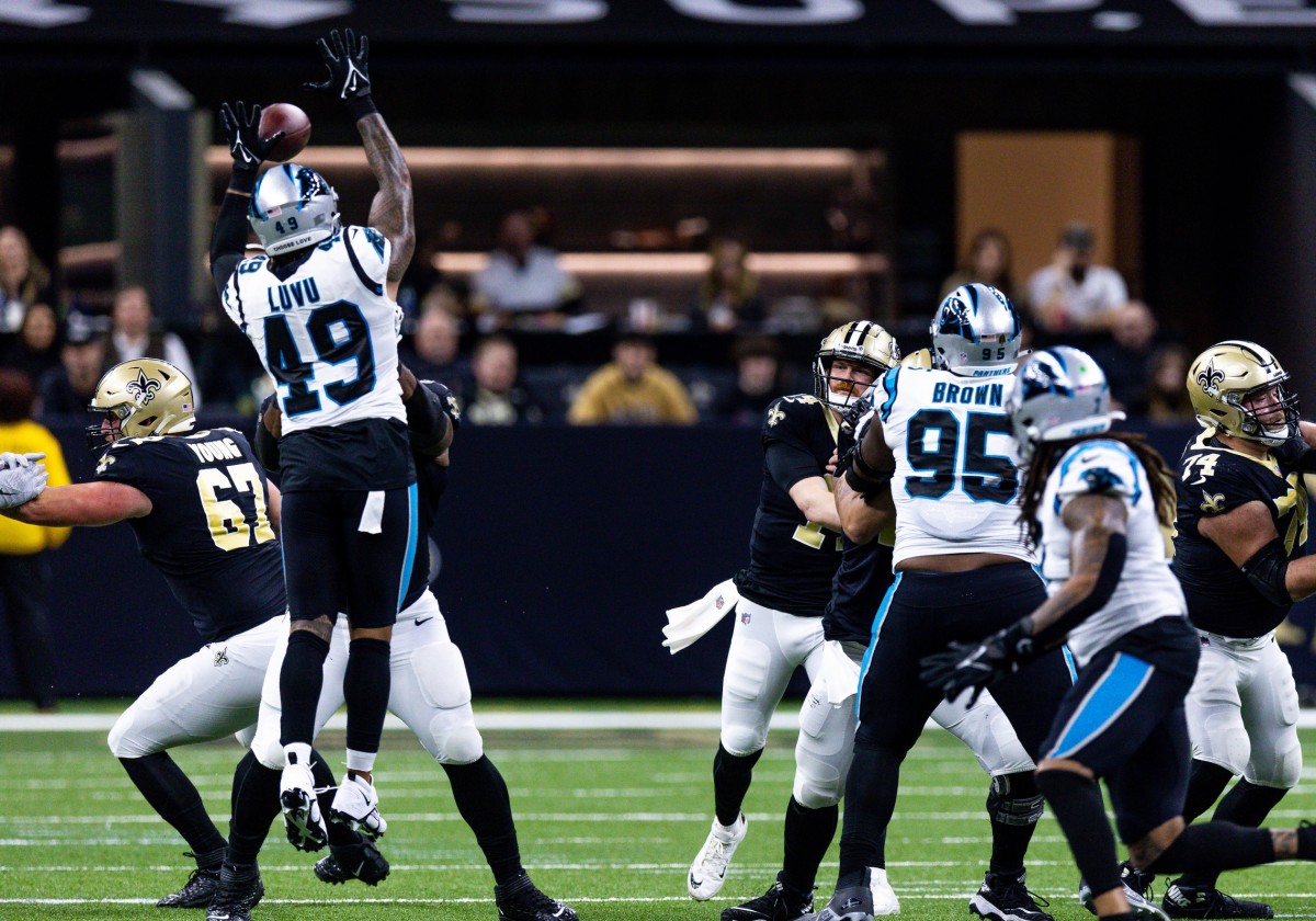 Carolina Panthers linebacker Frankie Luvu (49) blocks a pass from New Orleans Saints quarterback Andy Dalton (14). Mandatory Credit: Stephen Lew-USA TODAY 